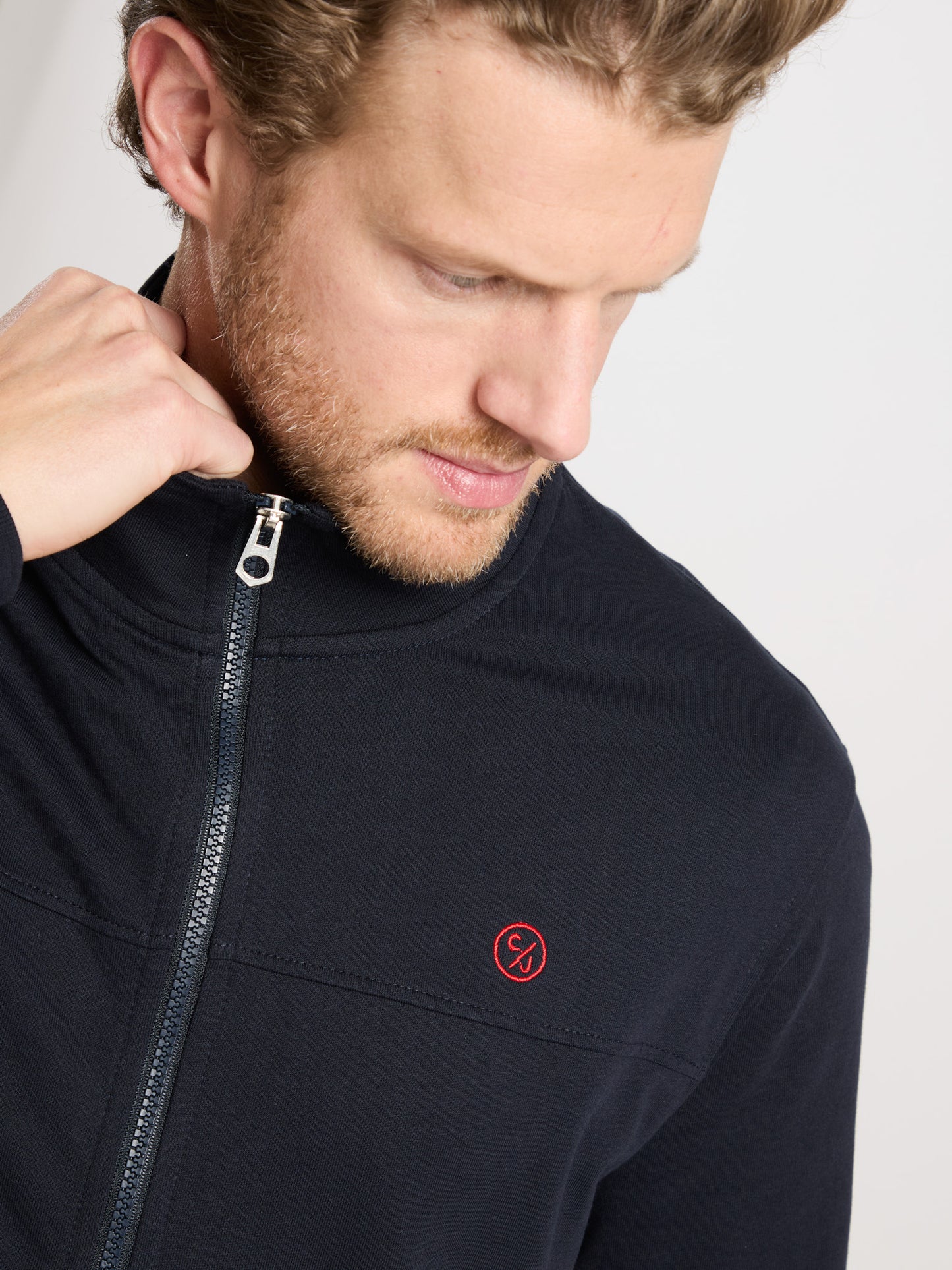 Men's regular sweat jacket with stand-up collar and zip in navy blue.