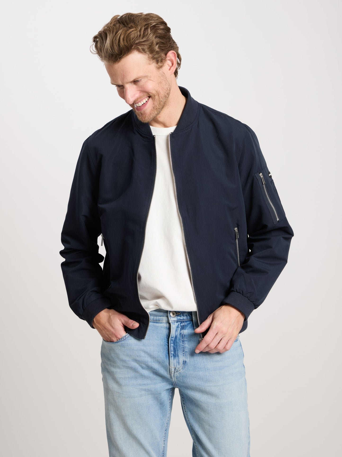 Men's regular zip bomber jacket with zip pockets navy blue.