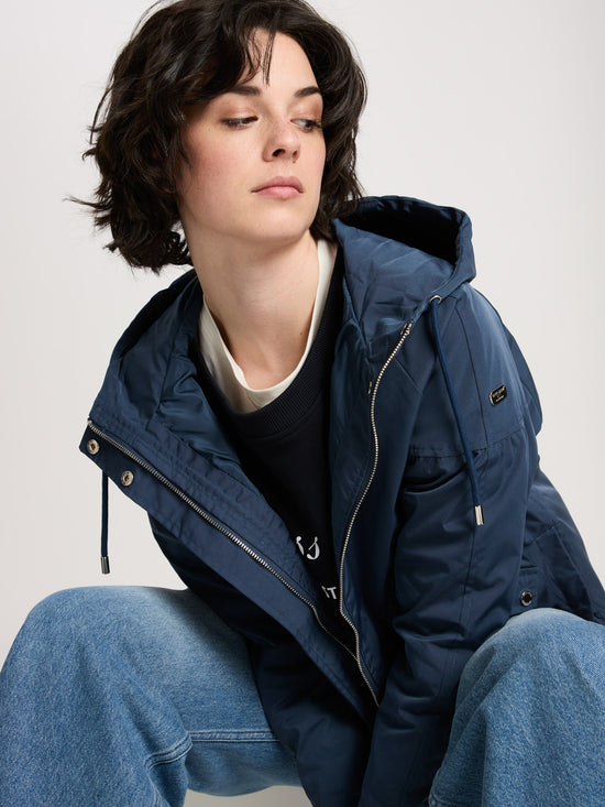 Women's regular jacket with hood, zip and snap fasteners in navy blue.