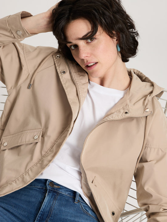 Women's regular jacket with hood, zip and snap fasteners, beige.