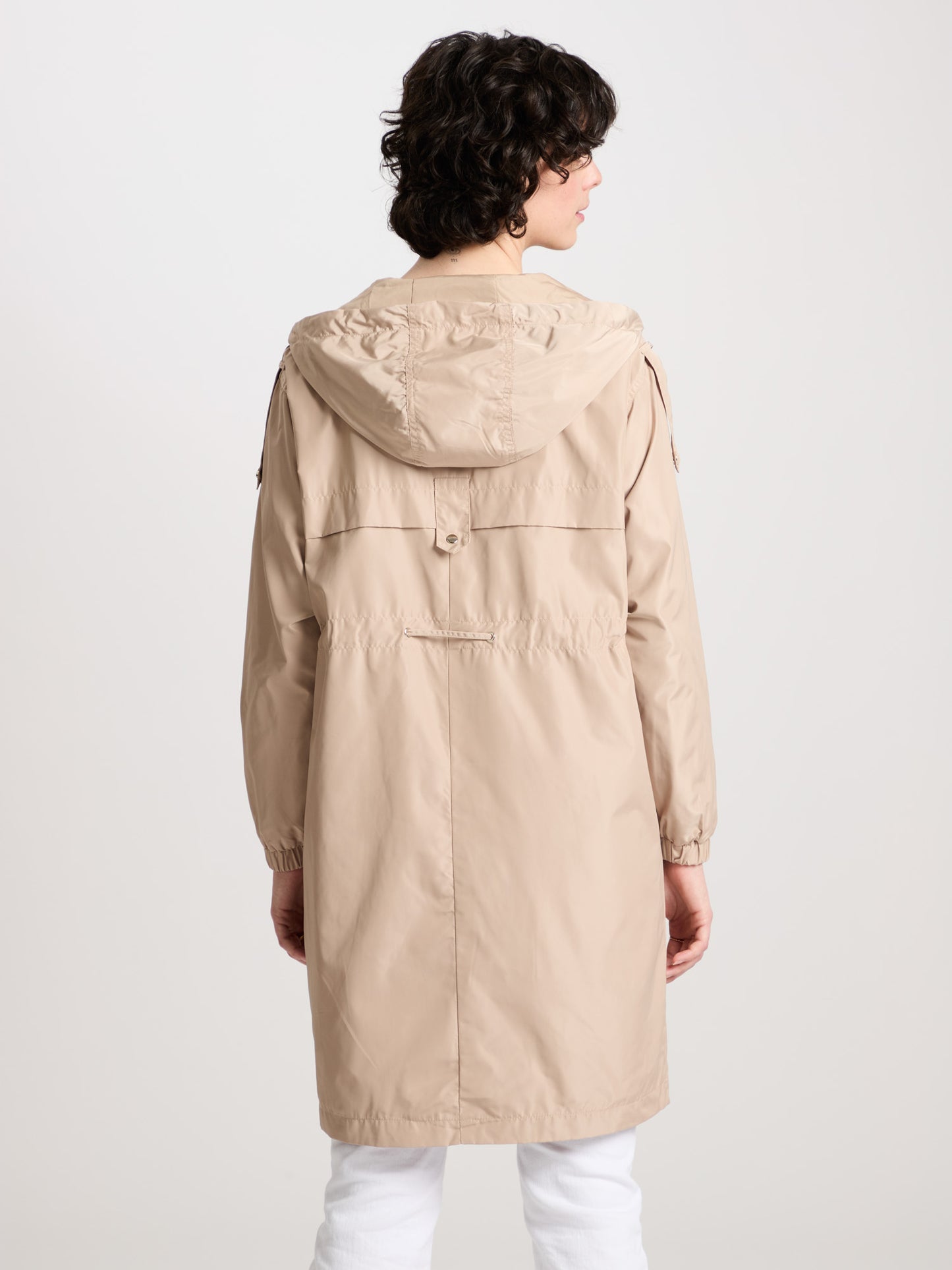 Women's regular coat with hood, zip and snap fasteners in beige.