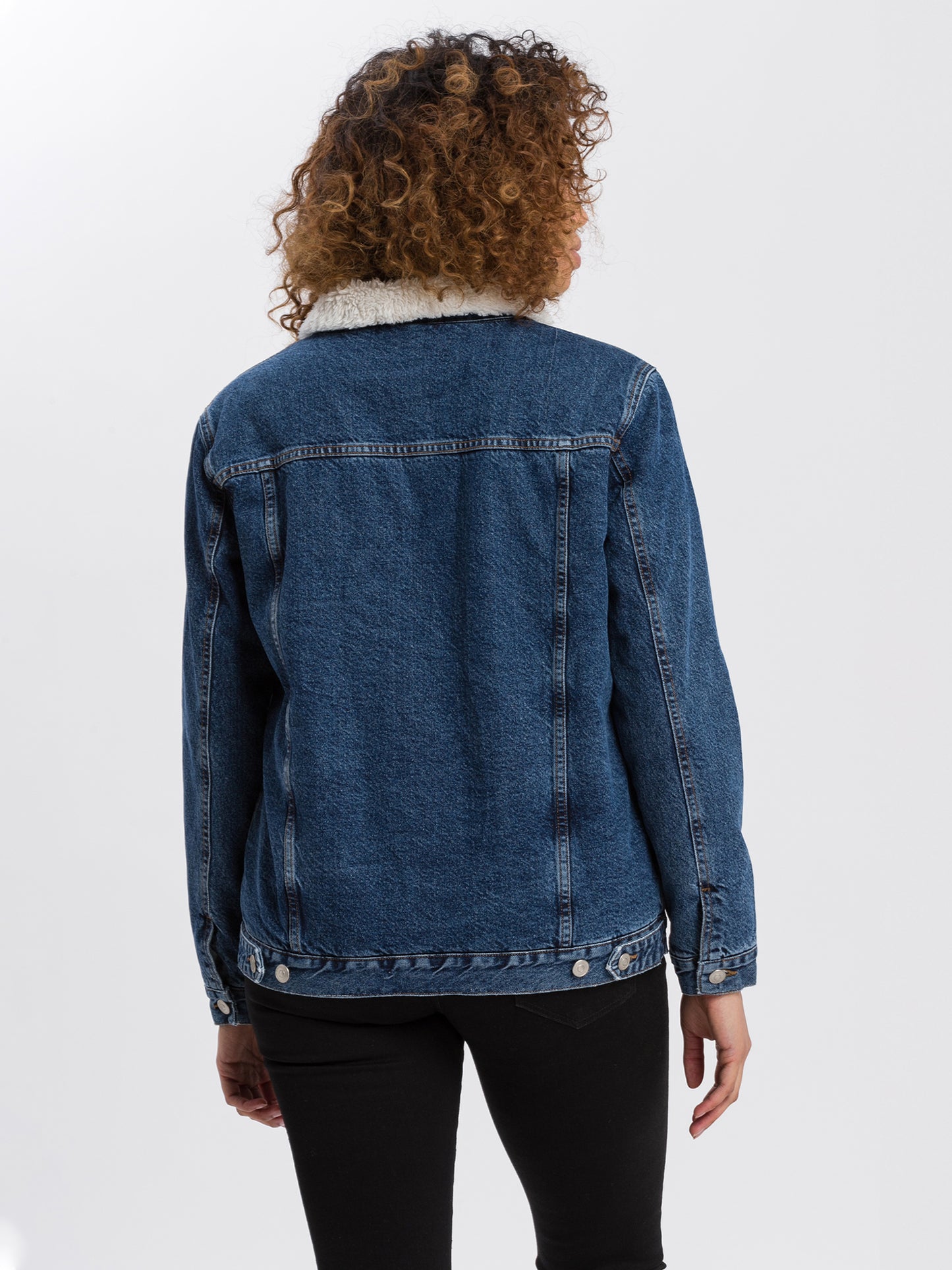 Women's oversized denim jacket with fur and button placket, dark blue.