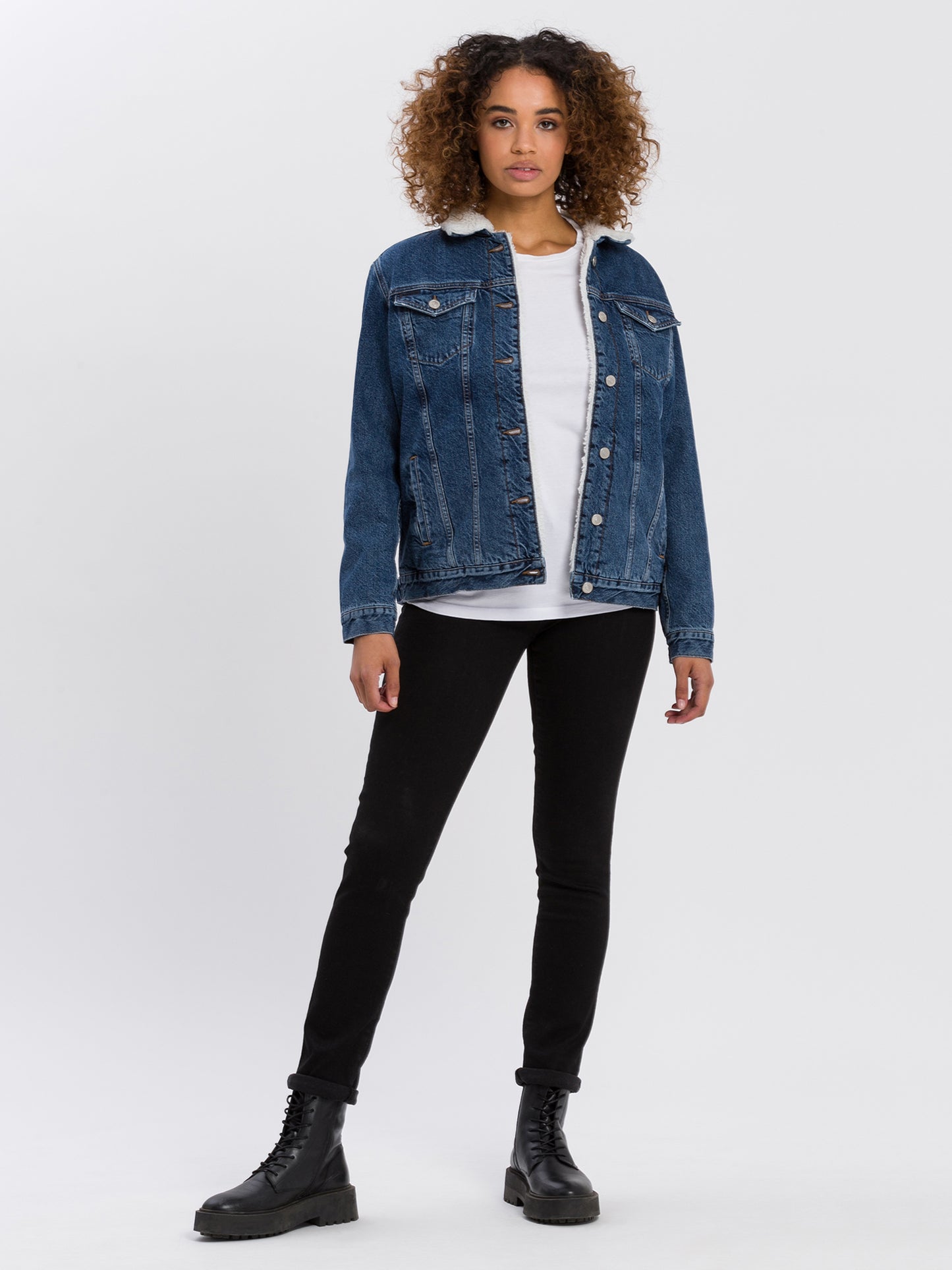 Women's oversized denim jacket with fur and button placket, dark blue.